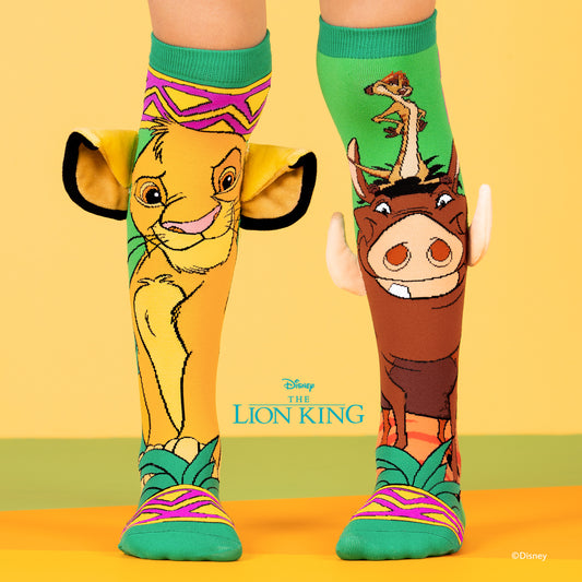 Disney Lion King knee high socks featuring Simba, Timon and Pumbaa with 3D plush ears and tusks in colorful design.
